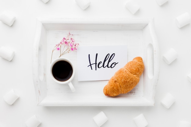 Tray with breakfast and marshmallow beside