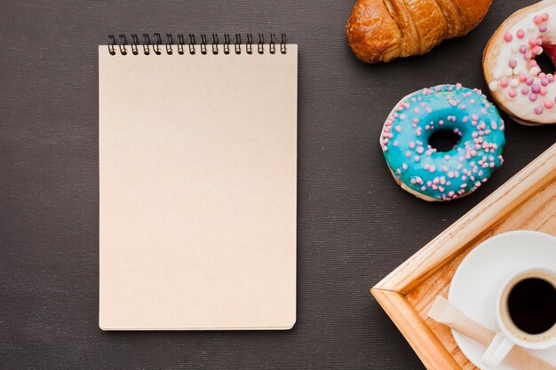 Tray with breakfast and notebook