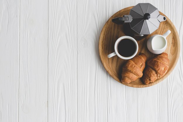 Tray with coffee and croissants