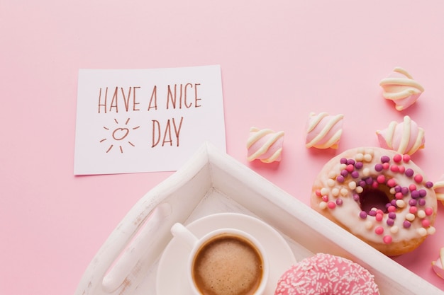 Tray with doughnut for breakfast and coffee