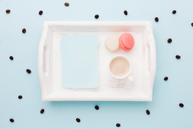 Tray with macarons and coffee