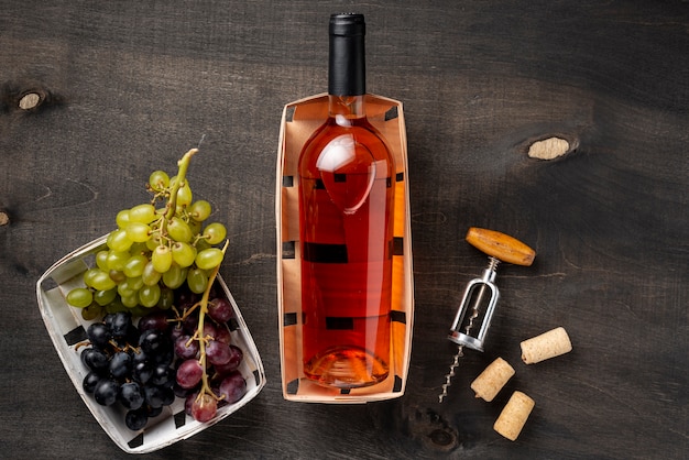 Tray with wine bottle and organic grapes