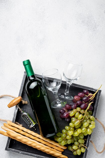 Tray with wine bottles and copy-space