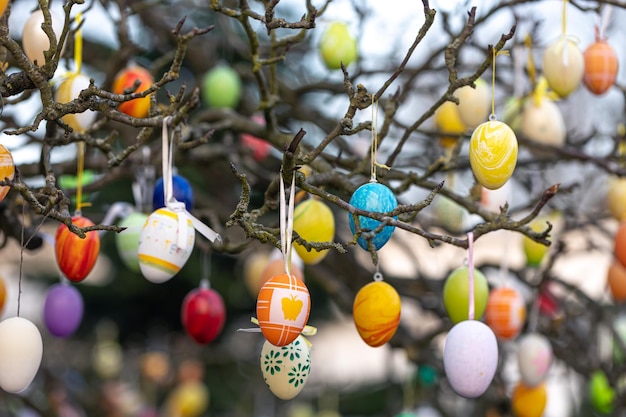 Tree decorated with colorful easter eggs street easter decor