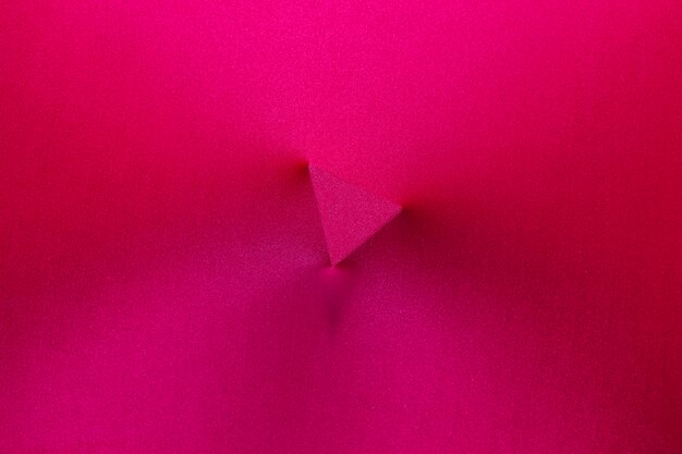 Triangle imprint in middle of magenta fabric