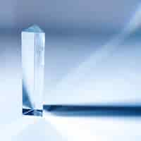 Free photo triangular long crystal diamond on colored background