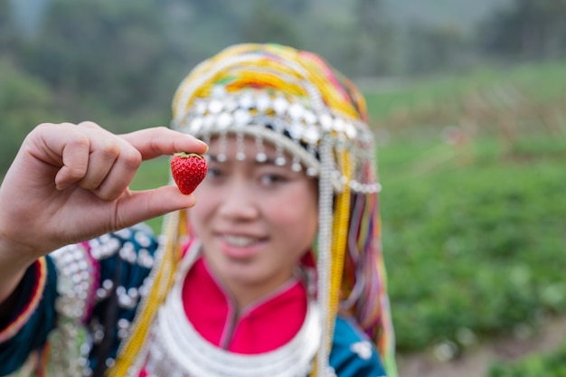 Free photo tribal girls are collecting strawberries