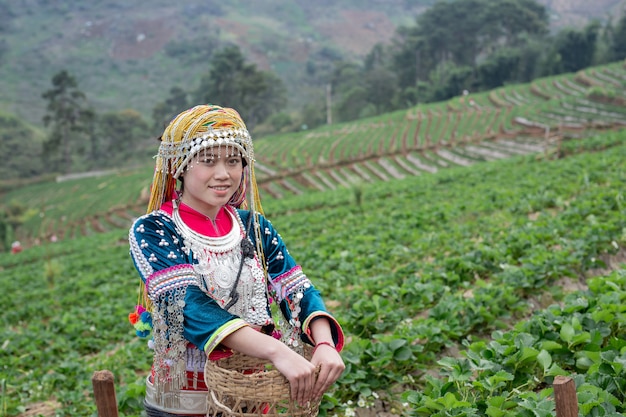 Free photo tribal girls are collecting strawberries