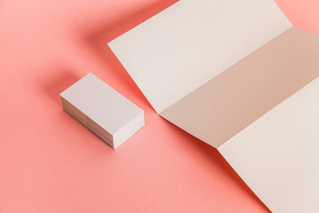 Trifold paper and stack of business cards