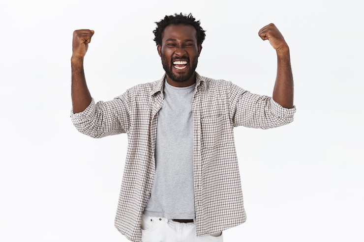 Free Photo triumphing lucky african-american bearded guy feeling like champion