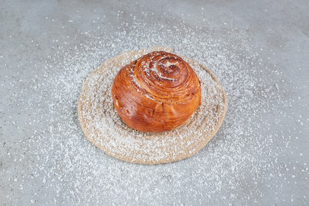 Trivet under a sweet bun on marble surface