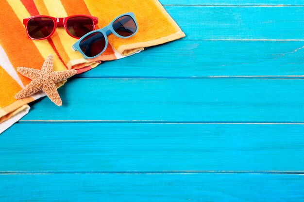 Tropical beach background with sunglasses 