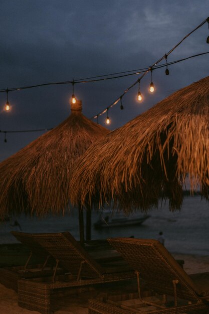 tropical beach straw umbrellas, vintage light bulbs, tropical style and mood