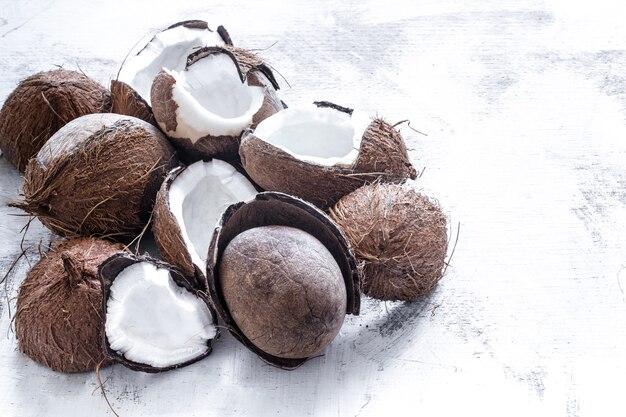 Tropical fruit halved rozbitogo coconut on a light background, the concept of organic fruit