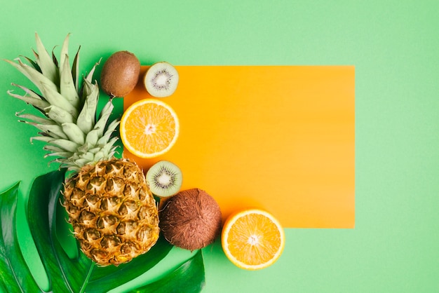 Tropical fruits background with card template
