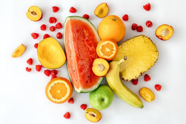 Tropical fruits on a white background top view