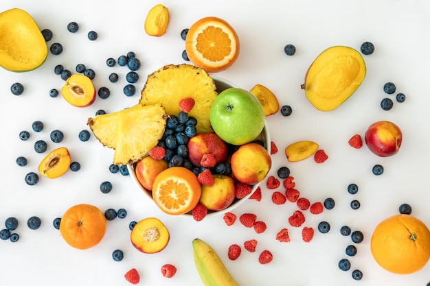 Tropical fruits on a white background top view