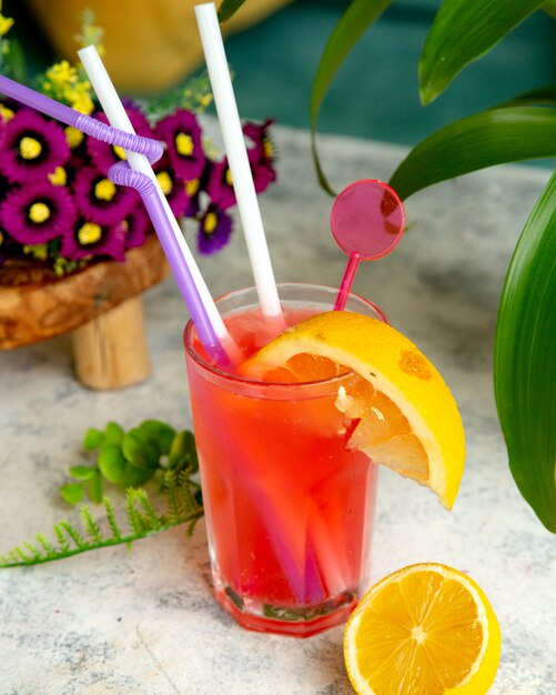 Tropical juice with orange slice on it