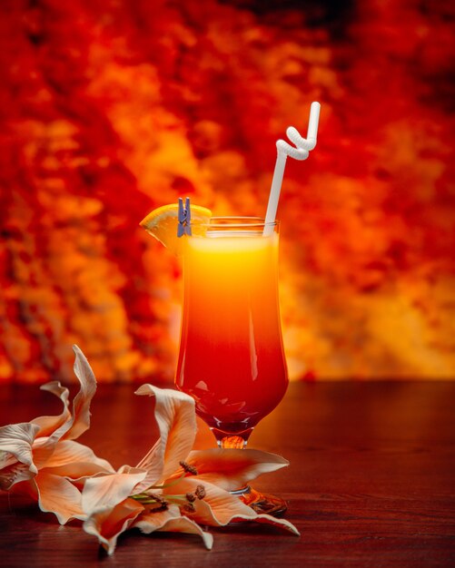 Tropical juice with pipe and lemon slice