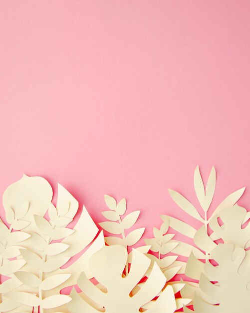 Tropical leaves in paper cut style in pink
