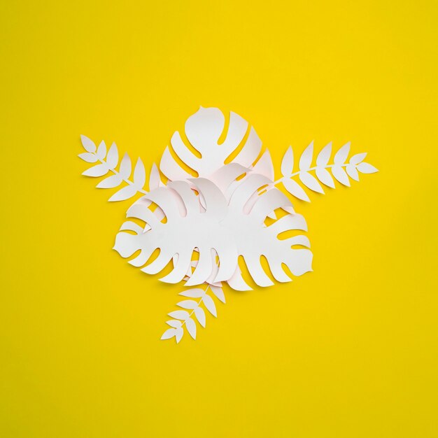 Free photo tropical monstera in paper cut style on yellow background