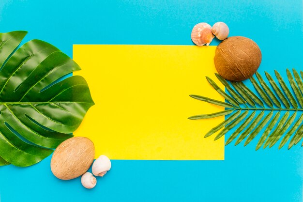 Tropical palm leaves on yellow and blue background