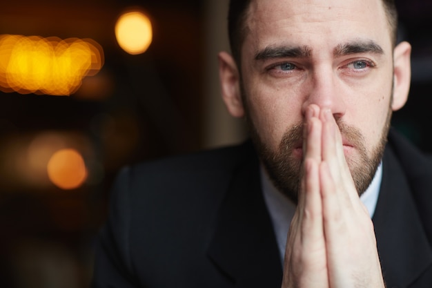 Free photo troubled  bearded businessman