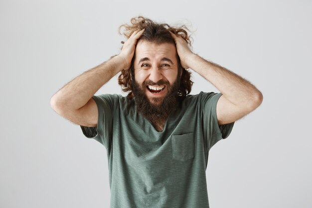 Troubled middle-eastern man screaming and panicking, having problem