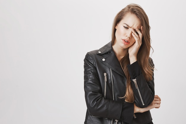 Troubled or tired woman facepalm and sighing