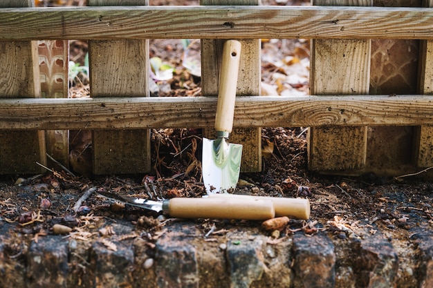 Trowels near fence