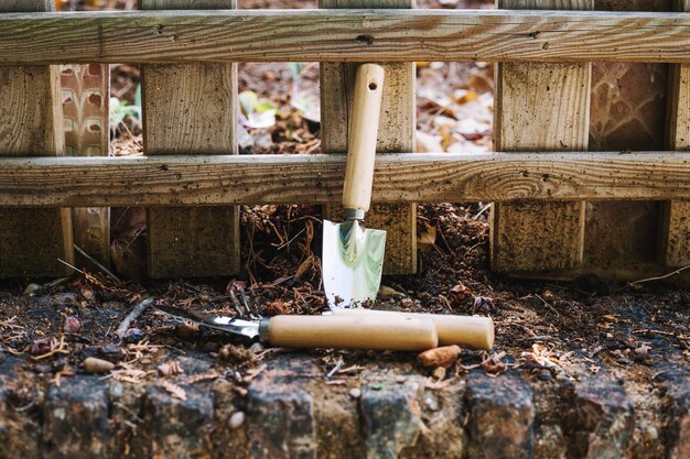 Trowels near fence