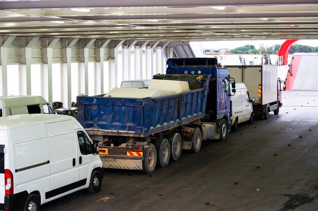 Trucks and minibuses located inside the ferryboat, Greece