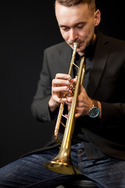 Trumpet player on dark background