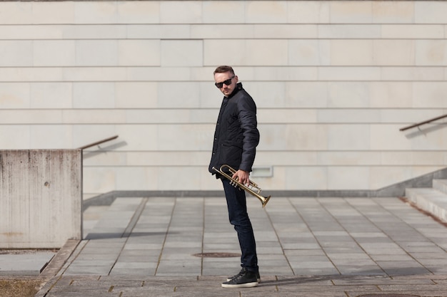 Trumpet player in urban environment