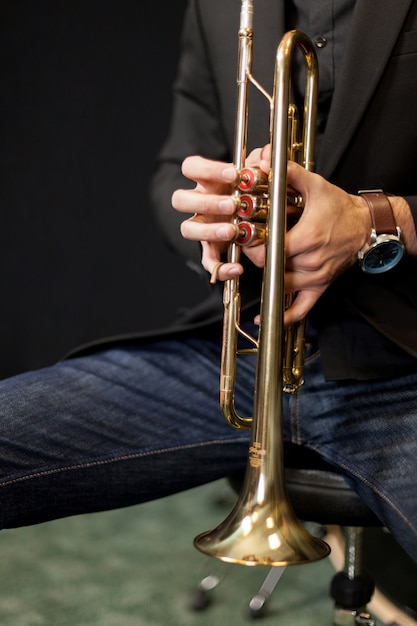 Trumpet player with his instrument