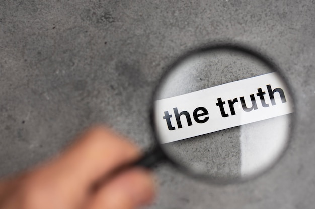 Free photo truth concept arrangement with a magnifier