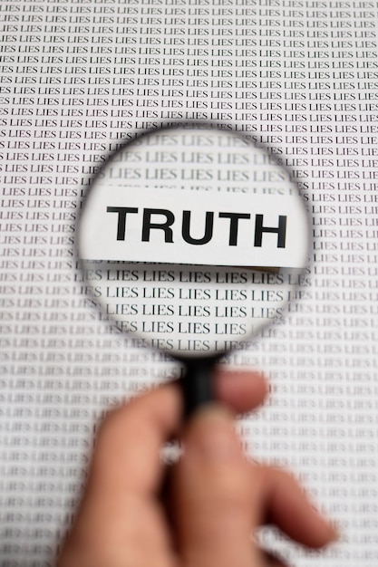 Free photo truth concept arrangement with a magnifier