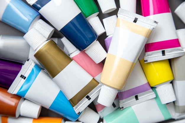 Free photo tubes of acrylic paint in different colors close up