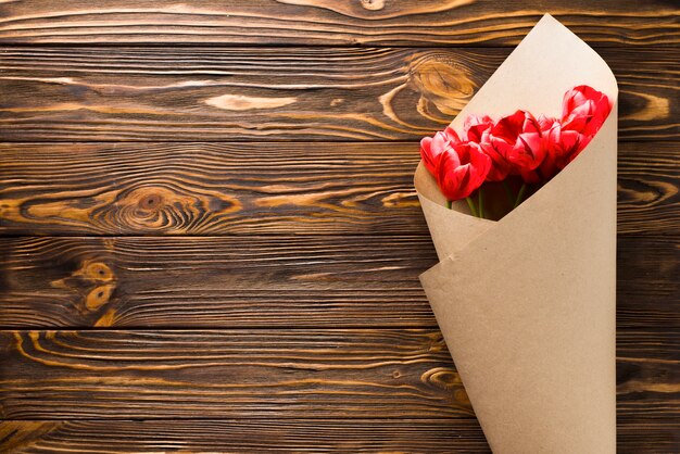 Tulip bouquet on wooden background