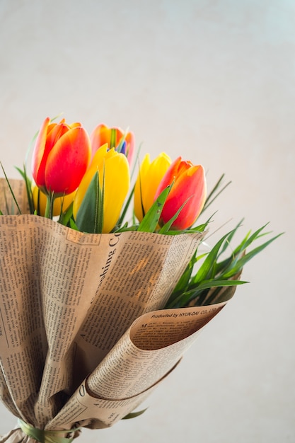 Tulip flowers bouquet in pack paper 