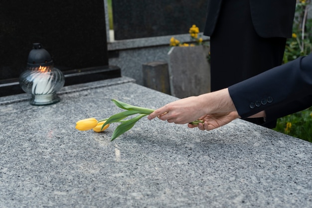 Tulips being brought to a grave at the cemetery