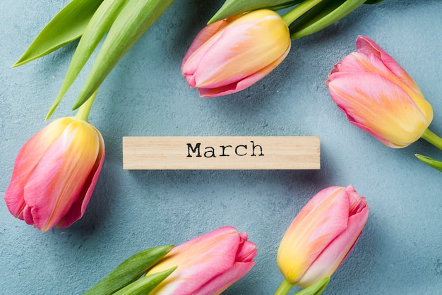 Free photo tulips frame with march month tag