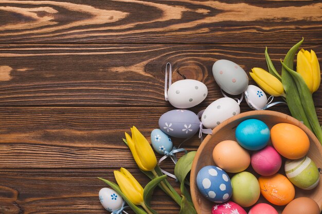 Tulips near bowl with eggs