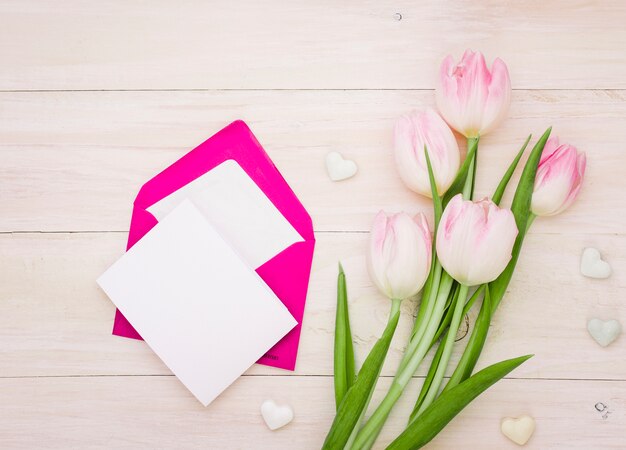 Tulips with blank paper and envelope 