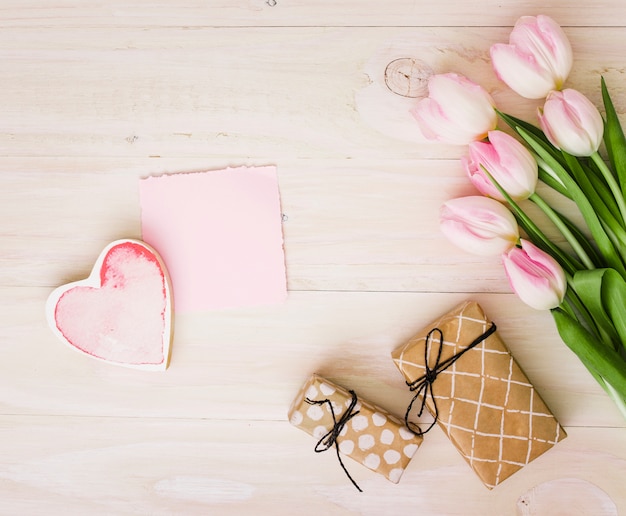 Tulips with gift boxes and paper 