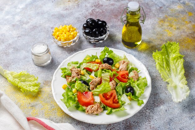 Tuna salad with lettuce,olives,corn,tomatoes