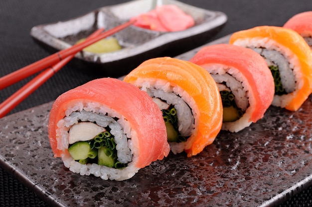 Tuna sushi roll with chopsticks