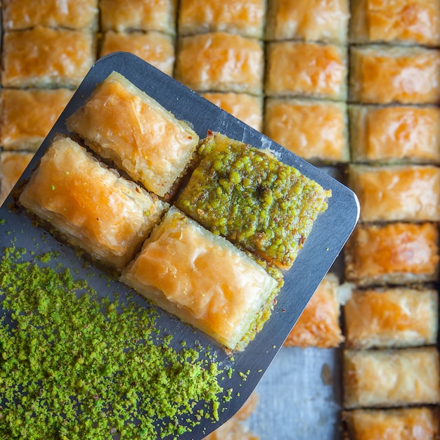 Free photo turkish baklava dessert made of thin pastry, nuts and honey