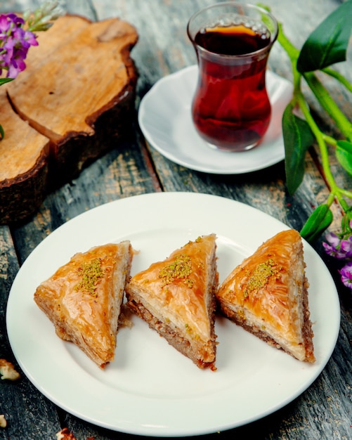 Turkish baklava with nuts and a cup of hot tea