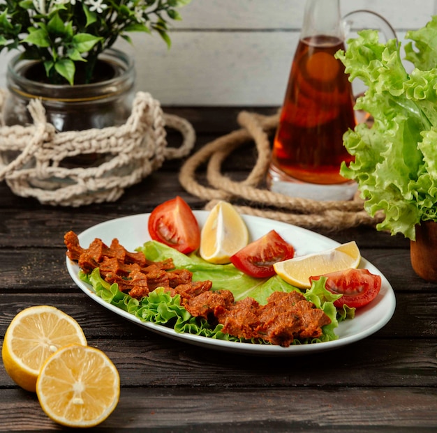 Turkish chiy kofte on a wooden table